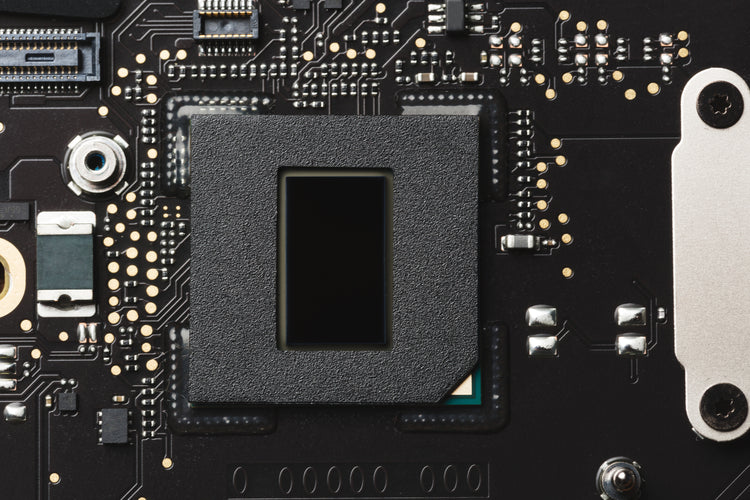 Close-up of a computer motherboard on the Naples PC repair bench