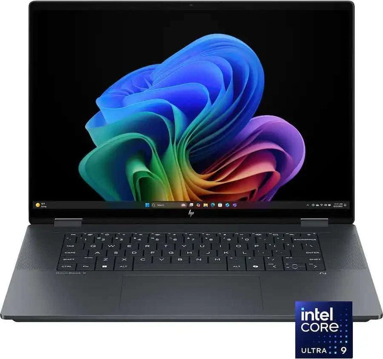 Laptop i9 with a dark grey metal body, black keyboard, large touchpad and vivid multicolour display